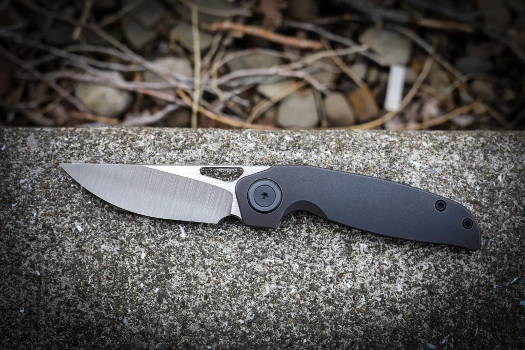 Belt satin and buffed S45-VN blade : and at the time of production, a new frame finish for me, blackened oxide finish that I’ve found to be incredibly durable! Coupled with blackened ti hardware, blackened and tumbled ti clip and spacer and blackened zirc collars and pivot.