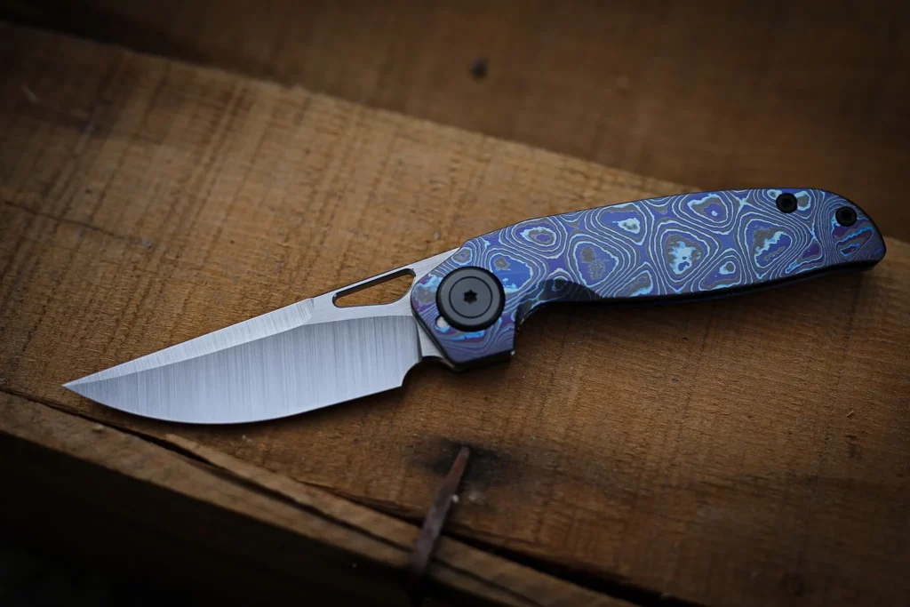 Full Zircuti Transient Framelock Custom - S45-VN belt satin blade, matte zircuti frames and satin zirc pivots/screws, backspacer and clip.